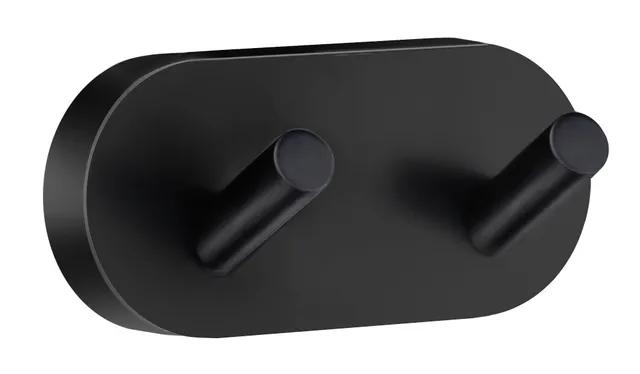 Svart, oval dubbelkrok med två cylindriska utstickare på framsidan.